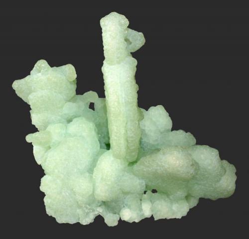 Prehnite
Upper New Street Quarry, Paterson, Passaic County, New Jersey, USA
9 x 9 cm
A 6 cm prehnite epimorph after anhydrite centered among smaller epimorphs (Author: Frank Imbriacco)