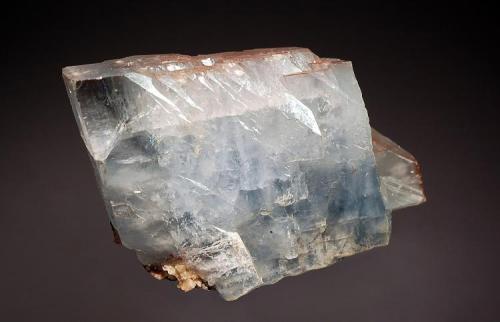 Barite
Frizington, Cumbria, Engand
5.2 x 6.4 cm
Lustrous blue spear-shaped crystals with a little reddish hue imparted by hematite. The photo below shows a few of the labels that accompanied this piece. (Author: crosstimber)