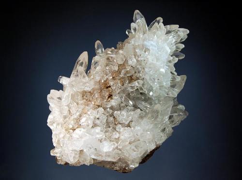 Calcite
Pallaflat Mine, Bigrigg, Cumbria, England
9.7 x 12.1 cm.
Transparent calcite prisms to 2.5 cm covering a hematitic matrix. (Author: crosstimber)