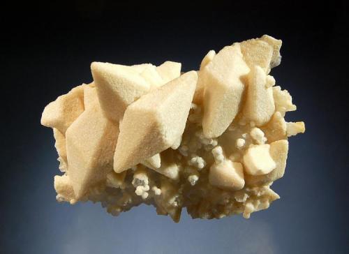 Dolomite ps. calcite
Droujba Mine, Laki District, Plovdiv Oblast, Bulgaria
6.1 x 7.9 cm.
Scalenohedral calcite crystals to 3.5 cm replaced by sugary-textured light tan dolomite. (Author: crosstimber)