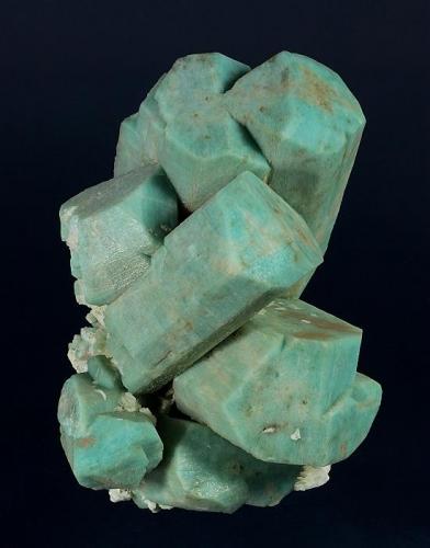 Microcline (v. Amazonite)  -- cleaned
Lake George area, Park County, Colorado, USA

130 x 124 x 104 mm

Classic, old-time Colorado Amazonite with sharp, light greenish-blue, blocky crystals of Microcline, on a matrix of white Albite (v. Cleavlandite). The Amazonites are well formed and fully terminated, several of which are well-developed twins. One crystal has a "slot" where it once enclosed a blade of what was likely Cleavlandite. This is an old AE Foote specimen, and was later sold by Filer’s (Redlands, CA) and the Bradleys (Los Angeles). Formerly in the Don Boydston and Joel D. Cohen collections. It is complete on all sides, unrepaired and has no damage. (Author: GneissWare)