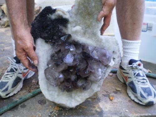 Cleaned plate of smokey/amethyst crystal plate(light purple in some of the crystals.  This will be a cool piece as the main crystals will be completely surrounded by snow white druzy.  There is still some manganese that I need to get off with acid (Author: Jason)