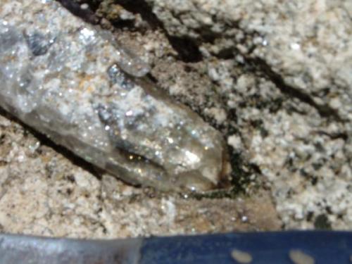 a clear quartz crystal in a freshly exposed pocket in the granite, clearview claim Passmore BC (Author: thecrystalfinder)