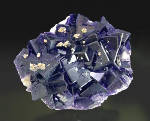 Fluorite with minor Calcite
Tounfit (Tounfite), Boumia, Morocco
Mined in 2006 
Specimen size: 8.1 × 6.8 × 2.6 cm = 3.2” × 2.7” × 1.0”
Main crystal size: 2.1 × 2 cm = 0.8” × 0.8”
Calcite fluorescent long & short UV
Photo: Reference Specimens -> http://www.fabreminerals.com/specimens/SHQ-reference-fine-minerals.php#EH88H6 (Author: Jordi Fabre)