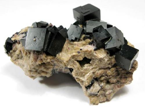 lustrous, outside black Fluorite crystals with orange inner cores up to 0.8 cm with Dolomite, dimensions of the specimen: 5 x 3 x 3 cm, Stollen Frisch Glück, Frohnau (Author: Thomas Uhlig)