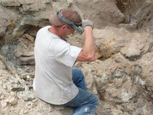 Terry with amethyst piece just recovered, covered by mud. (Author: John S. White)