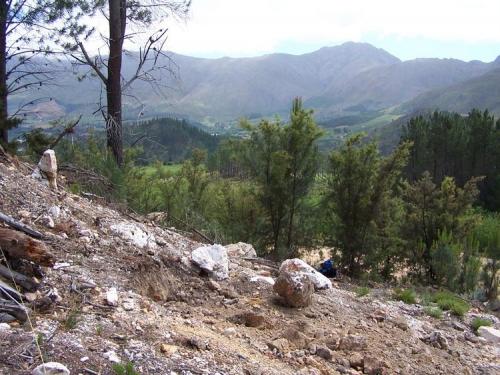 The farmer has cleared a good section of the small hill to use the soil for farm roads.  Guess what, he has uncovered crystal seams! (Author: Pierre Joubert)