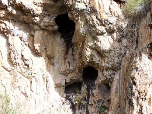 Small caves full of quartz crystals, but out of reach.  Robertson, WC. (Author: Pierre Joubert)