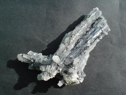 Stibnite on and covered with quartz
Kadamjai mine
8 x 3 cm (Author: alex chaus)