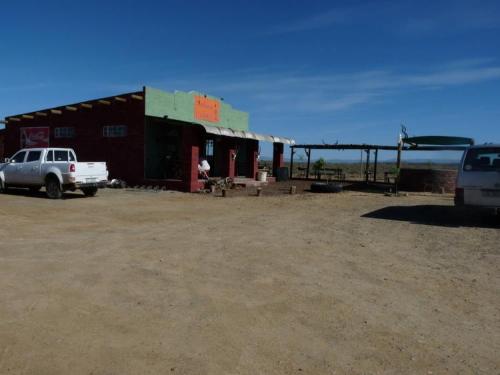 A very welcome stop about 100 km from the nearest shop; a farm stall with COLD COKE!!!  This is the only such place on a stretch of remote road, 255 km long. (Author: Pierre Joubert)