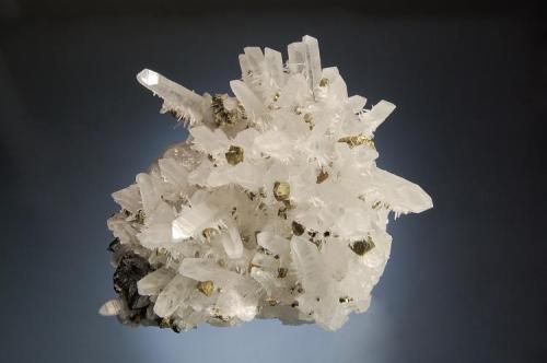 Quartz
Kruchev dol Mine, Madan District, Smolyan Oblast, Bulgaria
7.1 x 8.3 cm.
Quartz crystals to 4.0 cm. with a second generation of smaller crystals arising from the prism faces, with chalcopyrite and sphalerite. Mined in 2008. (Author: crosstimber)