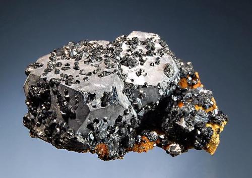 Galena
Gheturi Mine, Turt, Satu Mare, Romania
3.7 x 5.8 cm.
Steel-gray cuboctahedral galena with small black sphalerite crystals sprinkled over the surface. These rest on a light brown siderite matrix. Mined in 2003. (Author: crosstimber)