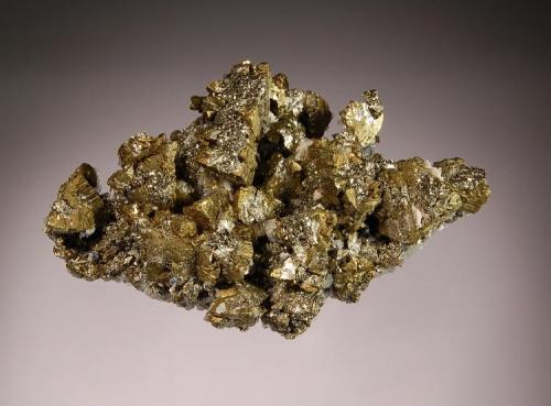Chalcopyrite
Gheturi Mine, Turt, Satu Mare, Romania
4.2 x 6.3 cm.
A floater specimen of tetragonal chalcopyrite crystals to 1.0 cm in the process of being replaced by brassy pyrite.  Mined in 2005. (Author: crosstimber)