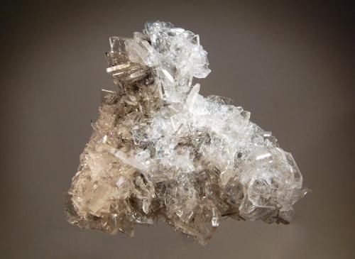 Barite
Baia Sprie, Maramures, Romania
9.5 x 10.5 cm.
Glassy transparent tabular barite crystals covering a thin matrix.  The barite crystals on the back of the specimen are heavily included with jamesonite. (Author: crosstimber)