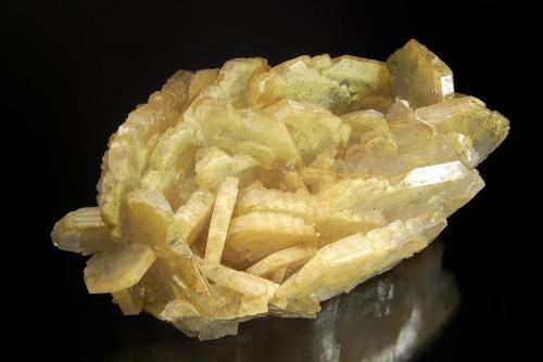 Barite
Baia Sprie Mine, Baia Sprie, Maramures, Romania
6.1 x 10.0 cm.
Bladed, semi-transparent, barite crystals with microscopic inclusions of yellow orpiment.  The crystals have unusual modifications which give them a saw-tooth form. (Author: crosstimber)