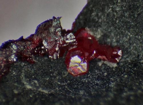 Cinnabar
New Idria, San Benito Co., California, USA
Photo width is 2.5mm (Author: crocoite)