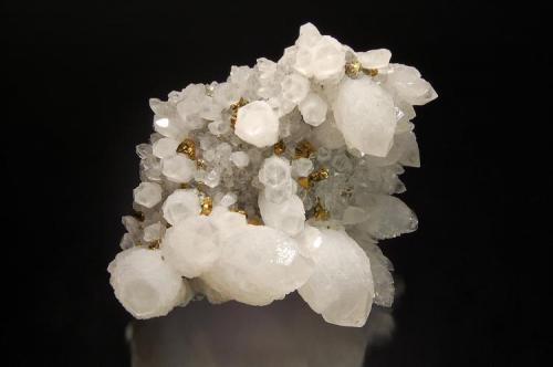 Quartz
Suior Mine, Cavnic, Maramures, Romania
8.2 x 10.1 cm.
Milky quartz crystals with transparent terminations associated with small brassy chalcopyrites. (Author: crosstimber)