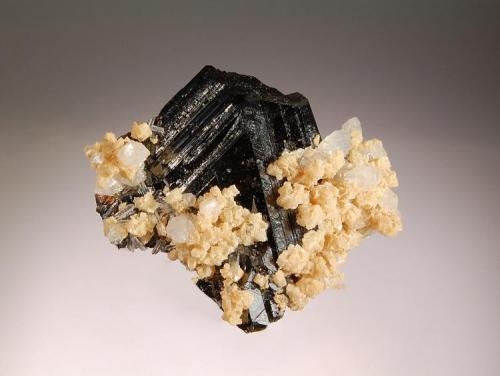 Sphalerite
Boldut Mine, Cavnic, Maramures, Romania
4.5 x 5.0 cm
Lustrous, black sphalerite to 4.5 cm, in combination with transparent quartz and light brown dolomite, Cavnic isn’t known for producing good sphalerites. This one was collected in 2004. (Author: crosstimber)