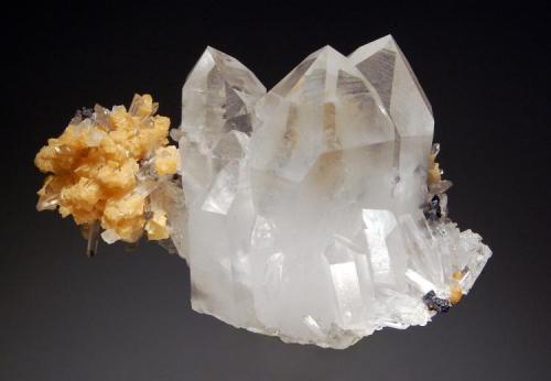 Quartz
Boldut Mine, Cavnic, Maramures, Romania
3.5 x 5.5 cm.
Transparent quartz, light tan dolomite and small metallic galena cubes. Collected in the 1980s. (Author: crosstimber)