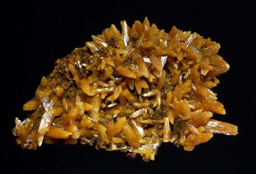 Wulfenite
San Juan Poniente vein, Ojuela Mine, Mapimi, Durango, Mexico
5.8 x 8.6 cm.
A limonitic matrix covered by butterscotch-colored wulfenite crystals with a pyramidal habit. (Author: crosstimber)
