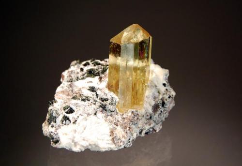 Fluorapatite
Cerro de Mercado Mine, Victoria de Durango, Durango, Mexico
3.2 x 4.4 cm.
Loose yellow crystals from this deposit are relatively common, but nice matrix specimens with gemmy crystals are a bit harder to find. Collected in 2008. (Author: crosstimber)
