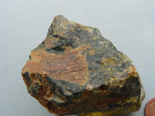 Uraninite, Gummite
Ty Gallen Mine, Morbihan, Brittany Area, France.
70*50 mm

Uraninite (black) with Gummite (brown and yellow)
Same specimen (Author: Benj)