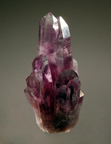 Quartz var. amethyst
Valenciana Mine, Amatitlan, Guerrero, Mexico
3.3 x 6.7 cm.
Amethyst crystals in parallel growth with grape-purple zones at the base grading to colorless at the terminations. (Author: crosstimber)
