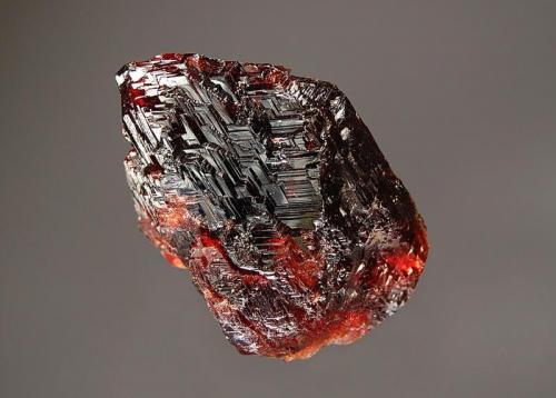 Spessartine
Pederneira Mine, São José da Safira, Minas Gerais, Brazil
4.0 x 4.7 cm.
Gemmy wine red spessartine crystal with a stepped surface indicative of very fast growth. (Author: crosstimber)