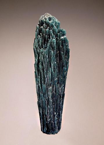 Elbaite
Golconda Mine, Governador Valadares, Minas Gerais, Brazil
2.0 x 7.7 cm.
Parallel growth of acicular indicolite crystals each with a trigonal termination. (Author: crosstimber)