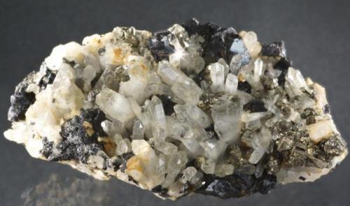 Quartz, sphalerite, pyrite.
Harding Vein, Carrock Mine, Caldbeck Fells, Cumbria, UK.
15 cm specimen, quartz to 3 cm, sphalerite to 2 cm. (Author: Ru Smith)