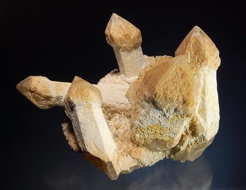 Quartz
Serra Negra deposit, São João da Serra Negra, Minas Gerais, Brazil
8.8 x 10.6 cm.
A cluster of sceptered quartz crystals to 6.3 cm with dull white prism faces and tan scepters. (Author: crosstimber)