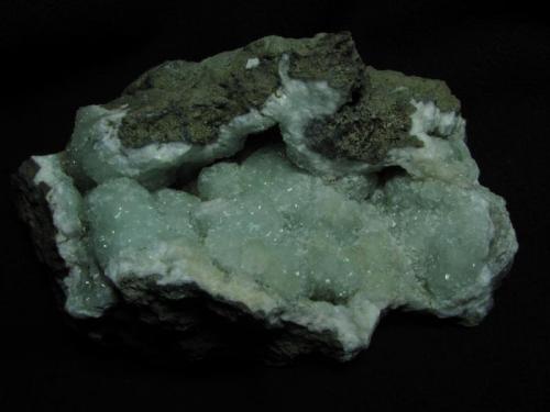 Prehnite
Sgurr nan Cearcall, nr Glen Brittle, Isle of Skye, Scotland, UK
12cm x 7cm x 5cm
The nicest prehnite specimen I have found, collected from a random small boulder on my last visit - I was very pleased ! The colour is a stronger green than the last specimen photo, but it is very difficult to capture.
Self-collected 2011 (Author: Mike Wood)