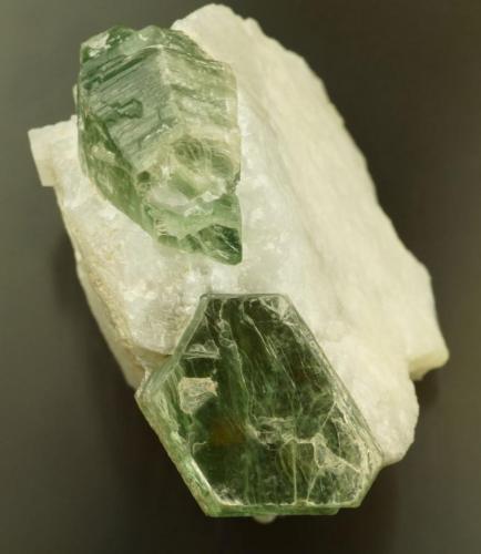 Mica
Oh Saung Taung, Le-Oo (Le U), W of Mogok, Burma.
23 mm crystals in 5 cm calcite matrix.
Green mica. (Author: Ru Smith)