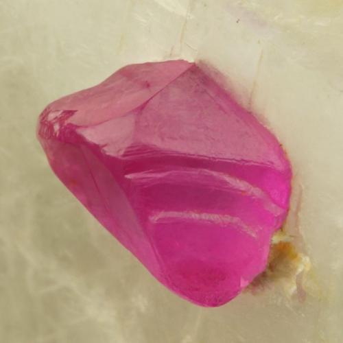 Corundum (variety ruby)
Mogok, Burma.
7 mm crystal in 3 cm calcite matrix.
Transparent trigonal crystal in calcite matrix. (Author: Ru Smith)