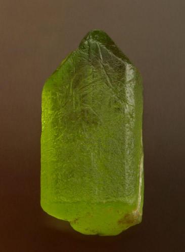 Olivine Group (variety peridot)
Pyaung Gaung mine, Bernardmyo village, north of Mogok, Burma (Myanmar).
15 mm. (Author: Ru Smith)