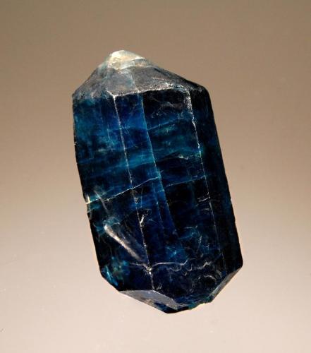 Fluorapatite
Ipirá, Bahia, Brazil
2.0 x 3.4 cm.
A loose doubly-terminated deep blue fluorapatite crystal from Bahia’s phosphate deposits. These apatites are radioactive due to the presence of uranium- and thorium-bearing oxides. (Author: crosstimber)