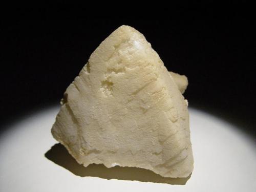 Calcite
Golden Cross Mine, Waihi, New Zealand
7x7cm
A single crystal, fairly coarse surface but a good luster. (Author: Greg Lilly)