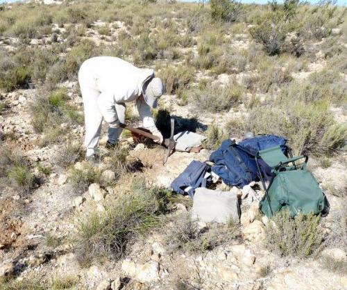 She uses a pick to remove larger quartz bearing rocks. (Author: Pierre Joubert)