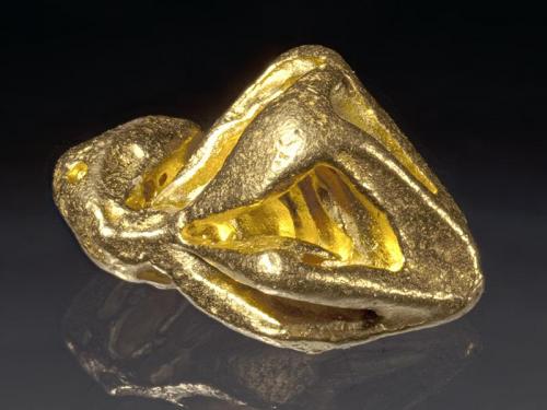 Gold
Mina Zapata, Santa Elena de Uairen, Bolívar, Venezuela
1,5 cm in lenght
Hoppered, octahedral crystal, characteristic for the locale. (Author: Simone Citon)