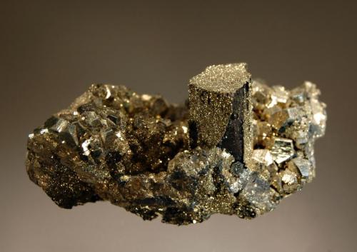 Enargite
Julcani Mine, Julcani District, Angaraes Province, Huancavelica Department, Peru
4.5 x 7.3 cm.
Prismatic black enargite crystal partially coated with drusy pyrite on a matrix of pyritohedral pyrite crystals. (Author: crosstimber)