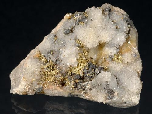 Gold
Sacarîmb (Nagyág), Deva, Hunedoara Co., Romania
5x4x1,5 cm
Gold in Quartz, with Sphalerite, from old classic locale. (Author: Simone Citon)