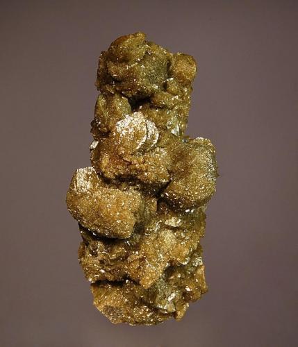 Siderite
Julcani Mine, Julcani District, Angaraes Province, Huancavelica Department, Peru
3.5 x 7.0 cm.
Brownish, flattened siderite rhombs stacked one on top of another and completely covering matrix. (Author: crosstimber)