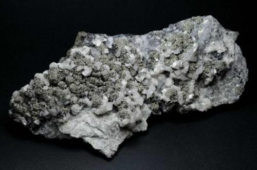 Dolomite, Pyrite, Calcite, Quartz
Qale-Zari Mine, South Khorasan Province, eastern Iran
Size is 19.3 cm in length. (Author: vhairap)