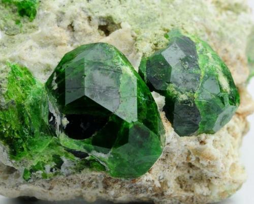 Andradite (var: Demantoid)
Belqeys Mountain (Kuh-e-Belgheys), Takab, West Azarbaijan Province, Iran
Larger crystal is 1.6 cm. The specimen is 5 cm in length (Author: vhairap)