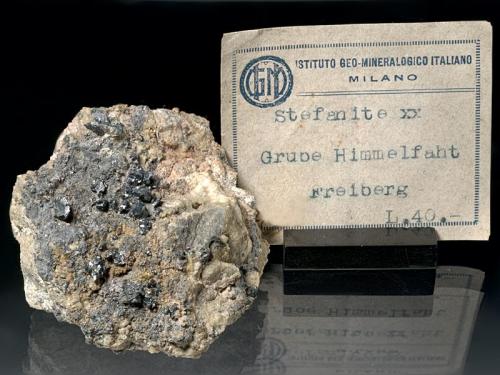 Stephanite
Himmelfahrt Mine, Freiberg, Freiberg District, Erzgebirge, Saxony, Germany
6x5x3 cm
Many crystals in classic aggregates scattered on the matrix, with an old italian label. (Author: Simone Citon)