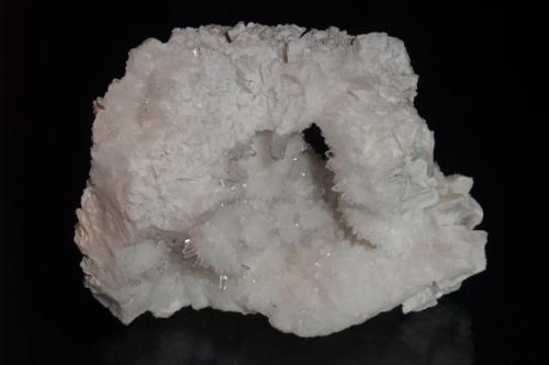 Quartz
Level 7, United Mine, Maratoto,  Coromandel Peninsular, New Zealand
11x7cm
The outside of this vug is composed of quartz pseudomorphs after calcite, the inside small but bright quartz crystals. (Author: Greg Lilly)