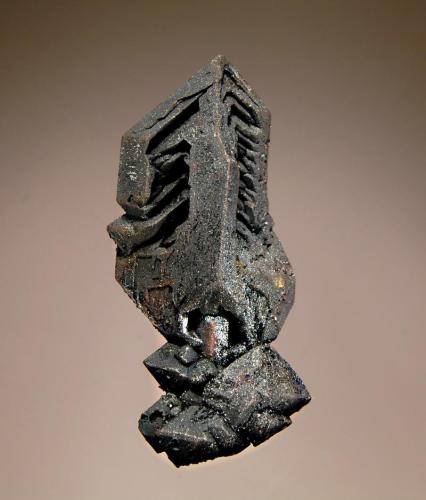 Hematite
Payún volcano, Altiplano de Payún Matru, Malargüe Department, Mendoza, Argentina
2.6 x 5.8 cm.
Elongated octahedral hematite pseudomorphing magnetite and showing skeletal herringbone ribs. Collected from a fumarole in 2001. (Author: crosstimber)