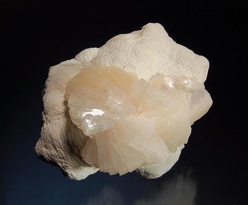 Heulandite
Aurangabad District, Maharashtra, India
5.7 x 8.3 cm.
A group of heulandite crystals grading from colorless to pale peach on chalky-white mordenite. (Author: crosstimber)