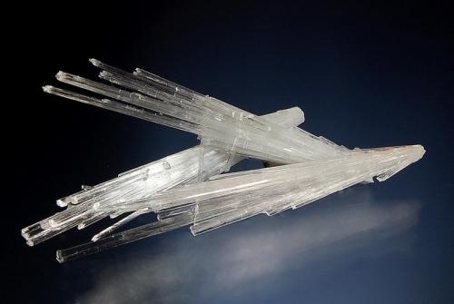 Scolecite
Junnar, Pune District, Maharashtra, India
4.5 x 9.4 cm.
Three intersecting sprays of slender colorless scolecite crystals. (Author: crosstimber)
