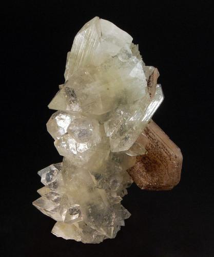 Apophyllite-(KF)
Jalgaon District, Maharashtra, India
4.5 x 7.1 cm.
A chalcedony stalactite covered with colorless apophyllite crystals and a pinkish stilbite crystal speckled with dark green jugoldite. (Author: crosstimber)